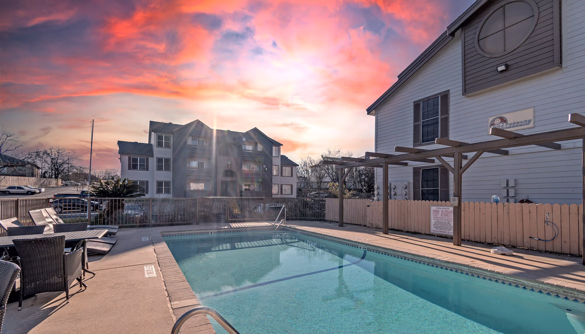 The Hill Country Apartments pool at sunset.